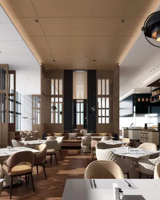 Intérieur d'un restaurant moderne avec des tables, chaises en tissu beige, grande fenêtre laissant entrer la lumière naturelle, décor élégant en bois et noir, espace bien éclairé et ambiance sophistiquée.