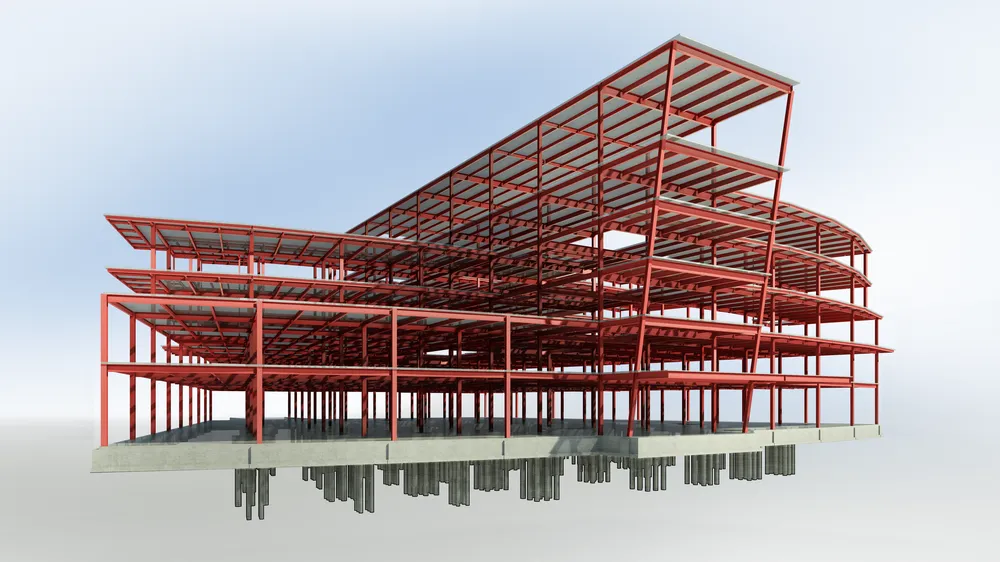 Structure en acier rouge d'un bâtiment en construction avec plusieurs étages, supportée par des piliers en béton.