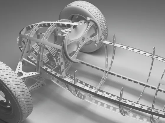 Modèle en fil de fer d'une voiture de course avec châssis, roues et structure en métal.