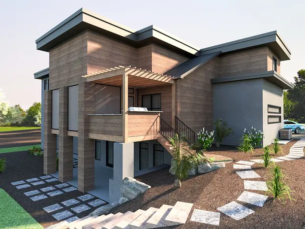 Une maison moderne en béton avec un balcon en bois et un barbecue, entourée d'un jardin avec un chemin en pierre, de l'herbe, et des arbres.