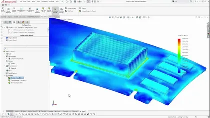 Capture d'écran d'une simulation de flux dans SOLIDWORKS montrant une carte graphique avec des dégradés de couleurs représentant la distribution de stress ou de température.